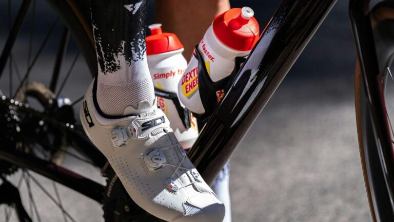 Water bottle mounted on bicycle frame, ready for hydration during cycling session