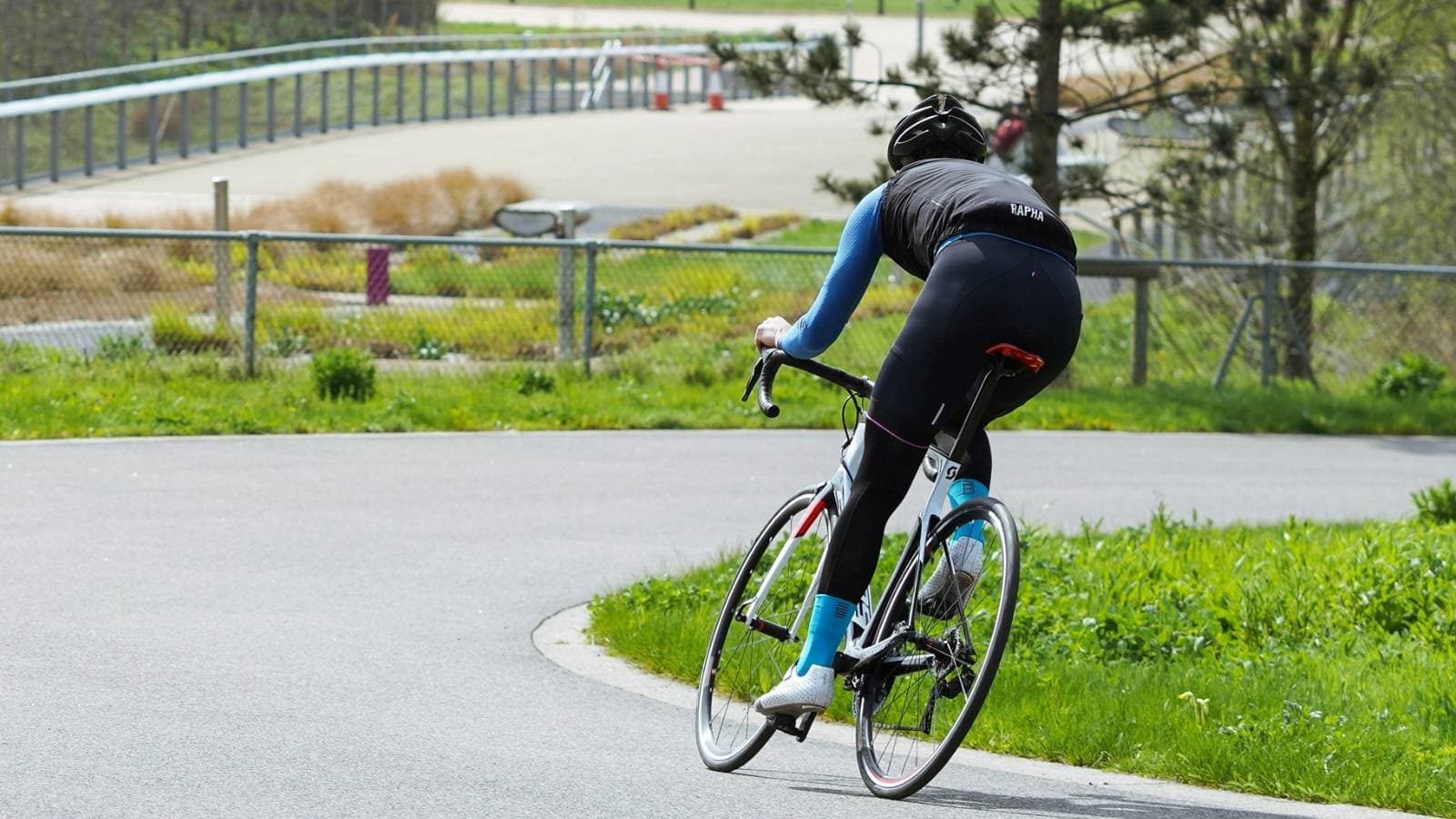 Road cyclist pedaling at a consistent cadence during a competitive race