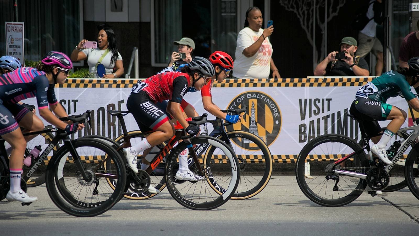 A group of cyclists riding together during a race, highlighting the endurance, pacing, and consistent training required to perform in long-distance cycling events.