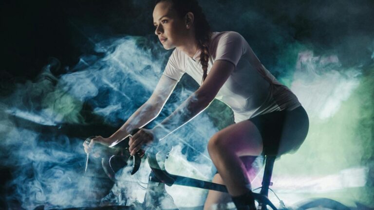cyclist riding indoors on trainer and doing endurance workout during off season