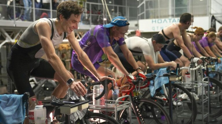 beginner cyclists adjusting resistance and cadence during indoor cycling workout session