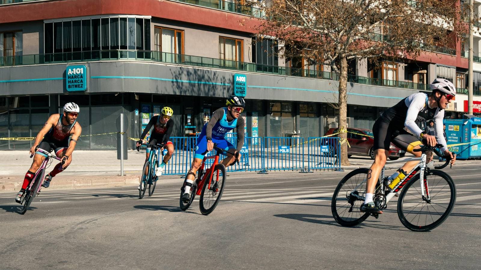 road cyclist leaning into a corner with proper body positioning and bike handling technique