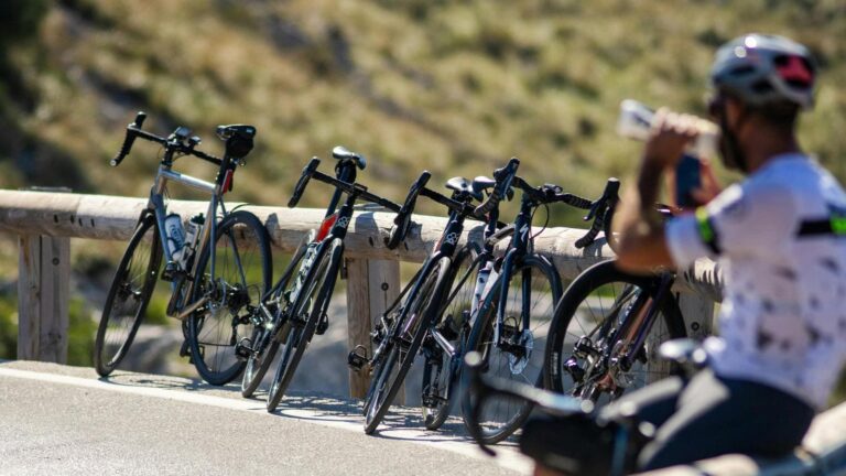 cyclist eating recovery meal with carbs and protein after intense cycling workout
