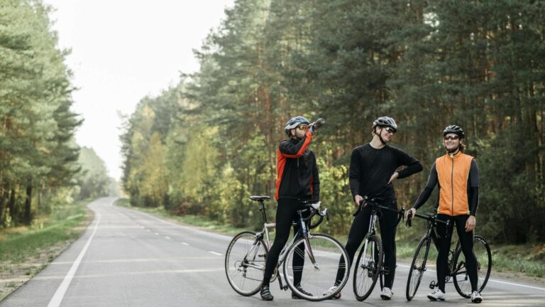 road cyclist using sports drink and snacks to fuel during 2 hour cycling training session