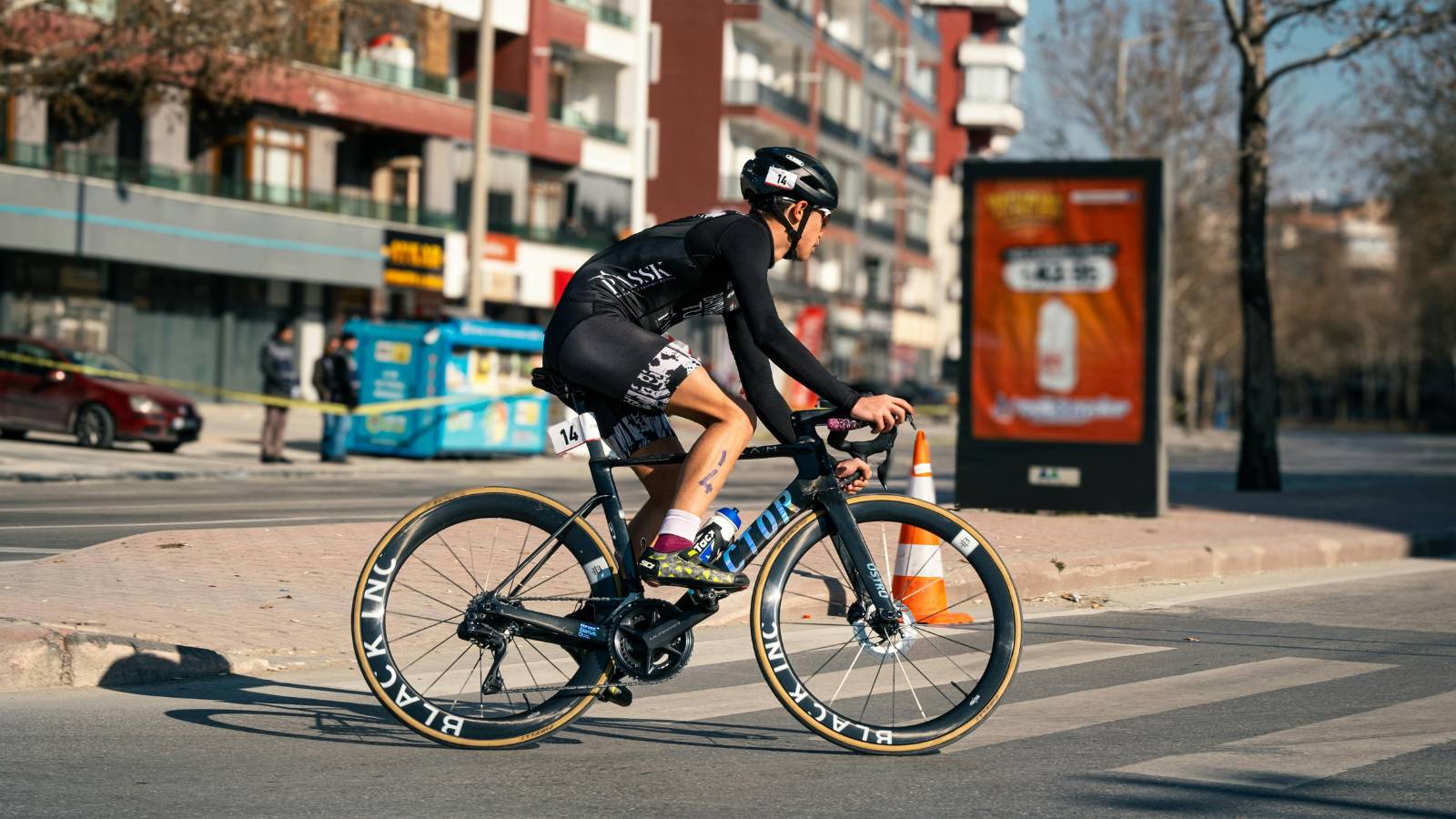 cyclist conserving energy and hydrating during long ride to avoid fatigue and maintain performance