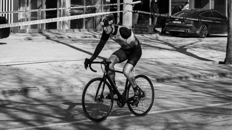 triathlete dismounting bike quickly and safely before entering transition area