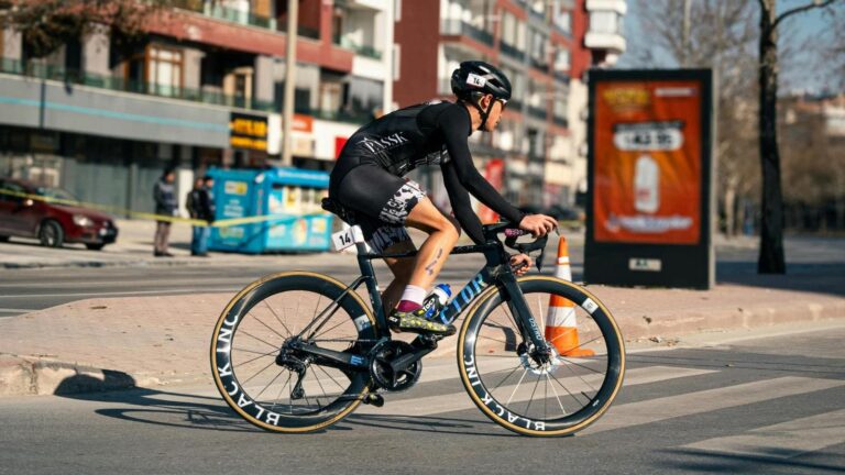 road cyclist monitoring power meter on bike computer during structured cycling workout