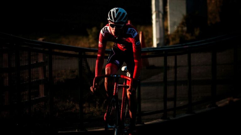 cyclist riding in peloton during road race to develop race tactics and cycling performance