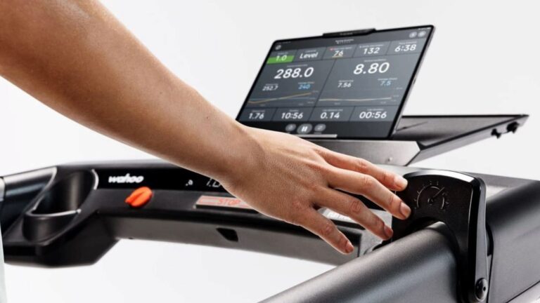 road cyclist analyzing cycling computer data after training ride while considering recovery and fatigue