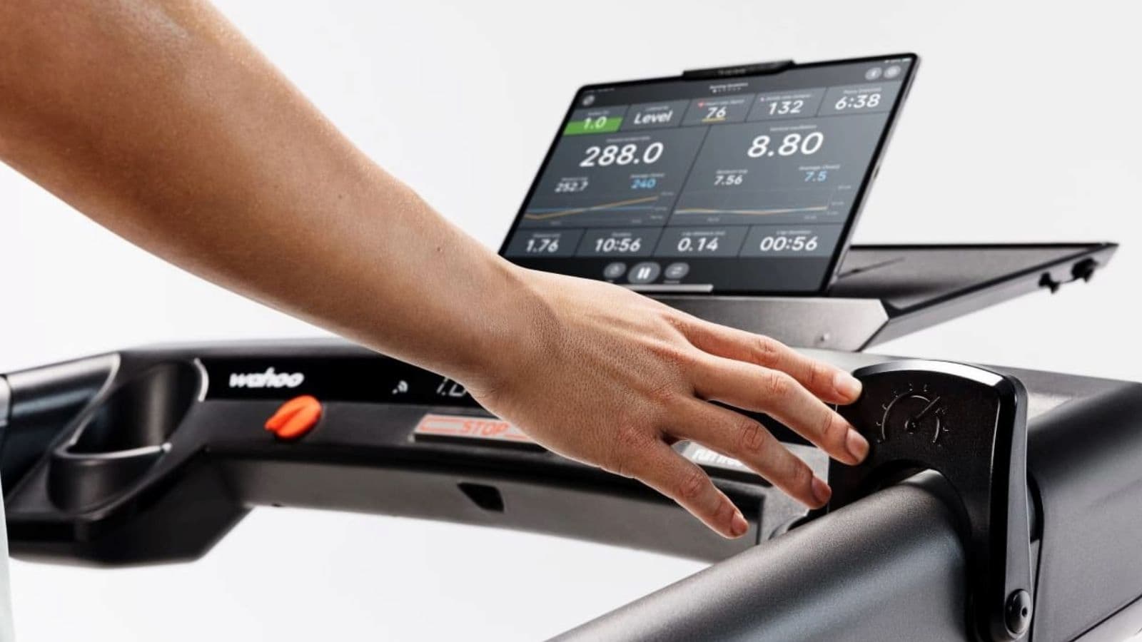 road cyclist analyzing cycling computer data after training ride while considering recovery and fatigue