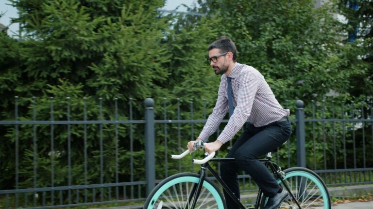 Cyclist completing a controlled interval on a safe open section of road during a bike commute.