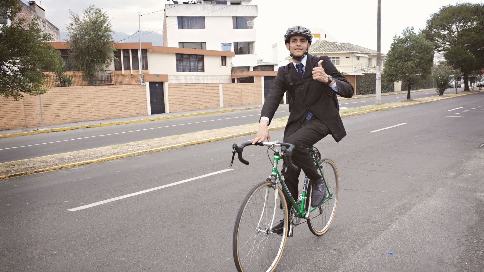 Cyclist commuting to work at a steady training pace while using the daily bike ride to improve cycling fitness.